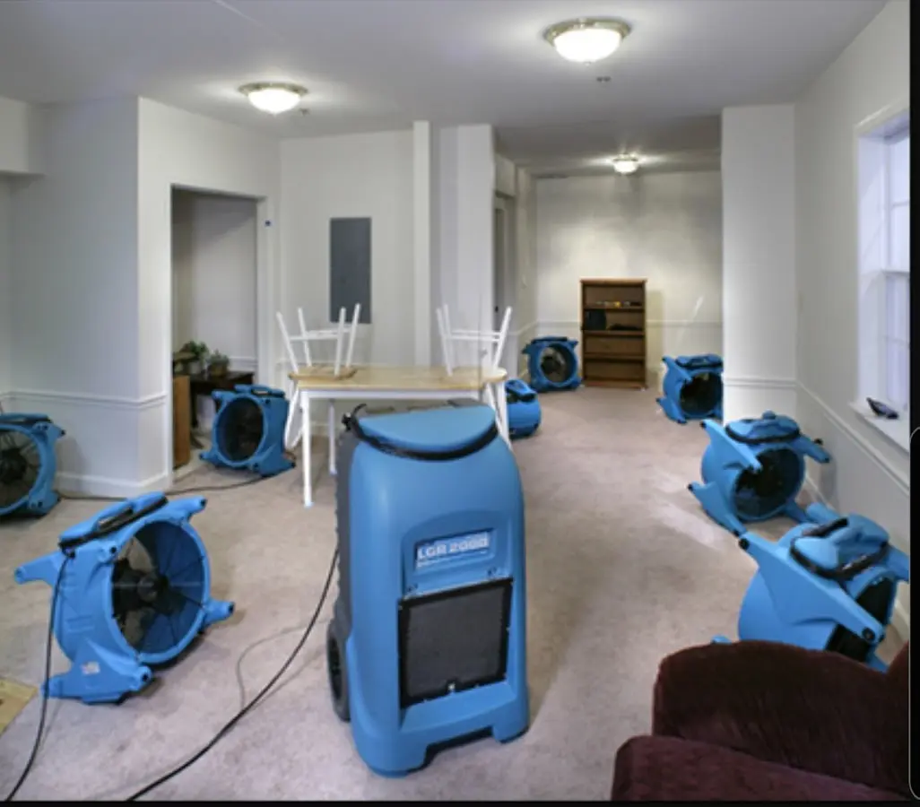 Air movers and dehumidifier setup for Water Damage Restoration in St. Michael